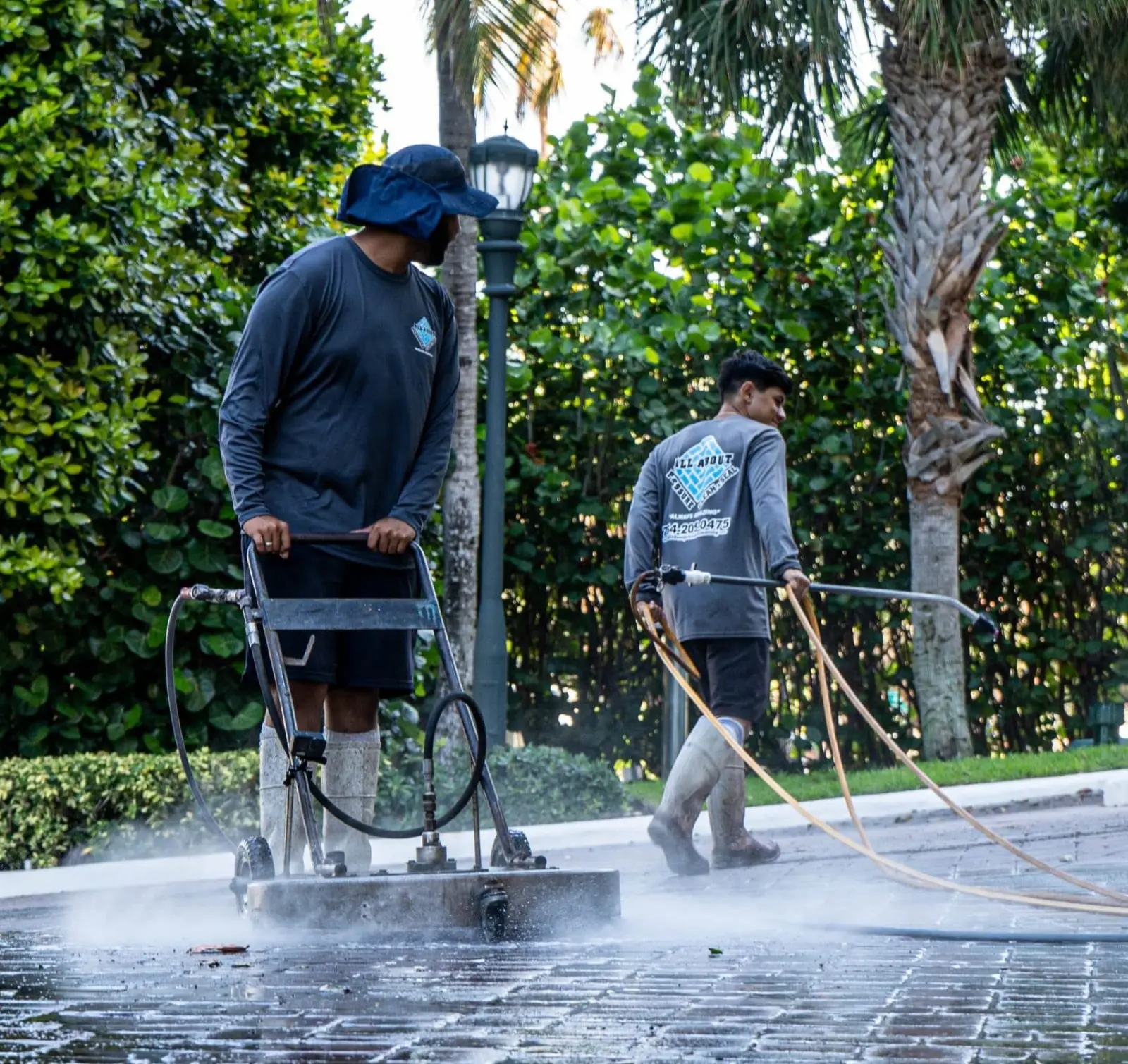 Technicians working on a paver surface