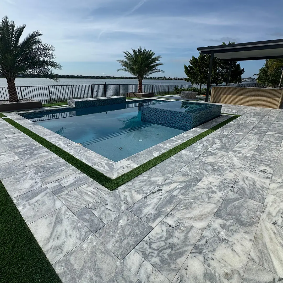 The same marble pool deck after cleaning and sealing
